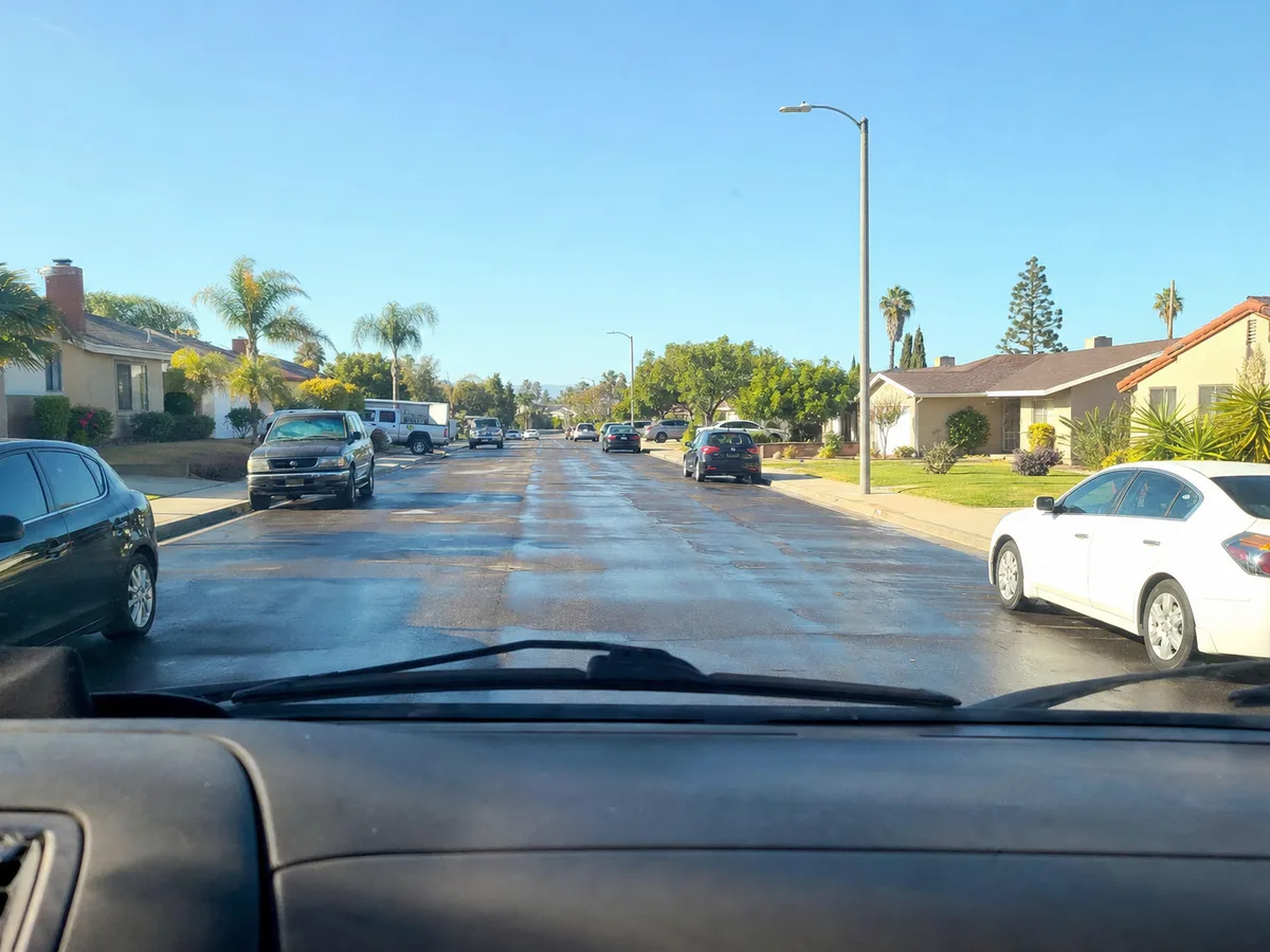 Service van arriving on a Studio City, CA street — local same-day coverage